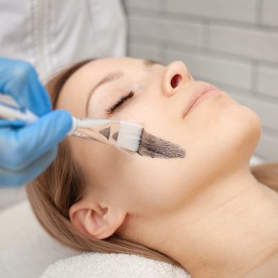 cosmetologist woman performs procedure