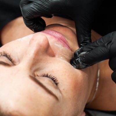 Epilations procedure for woman in beauty salon